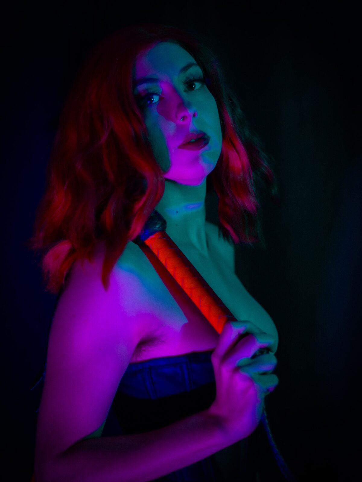 Neon portrait with flogger